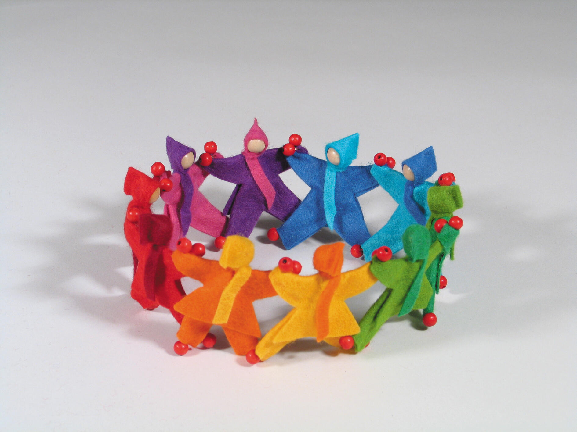 Kraul - Mitfahrpüppchen in Regenbogenfarben sort.
