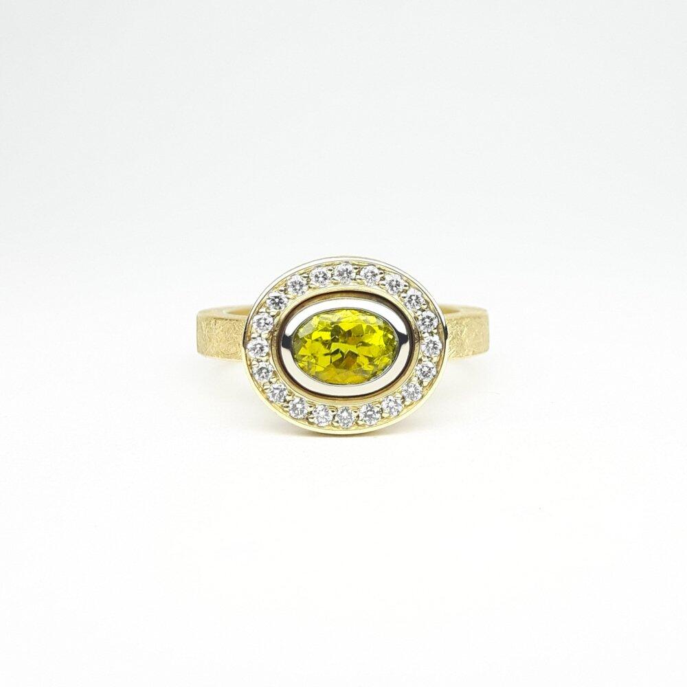 18k yellow and white gold ring with a yellow tourmaline and diamonds. One of a kind.