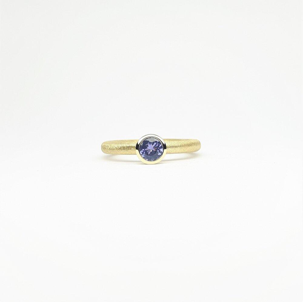 "combiring small", 18kt Gelbgold und Tansanit Ø5mm.