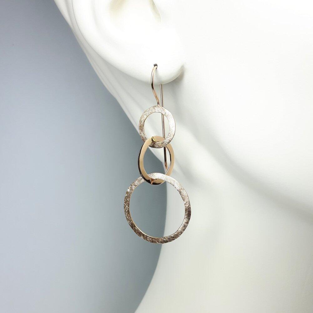 Boucle d'oreilles "dancing circles" en or rouge 18kt.