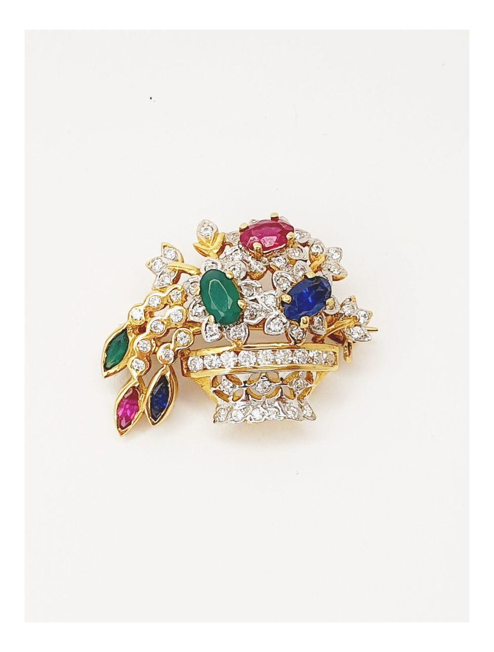 # Yellow and white gold brooch set with zircon