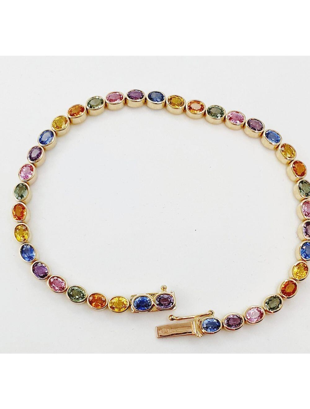 Reserved # Yellow gold bracelet with blue sapphire, yellow sapphire, green sapphire, orange sapphire, yellow sapphire, and pink sapphire.