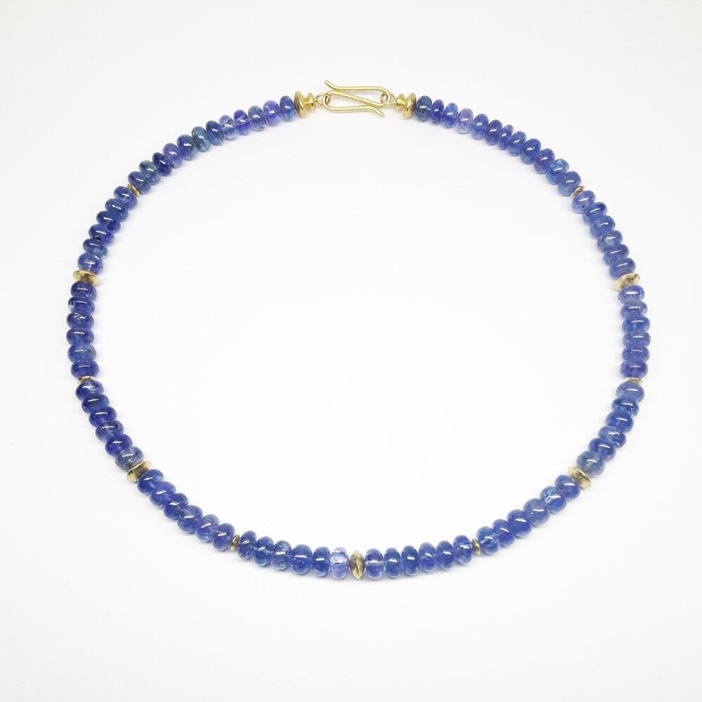 Collier aus 18kt Gelbgold und Tansanitrondelle. Unikat.