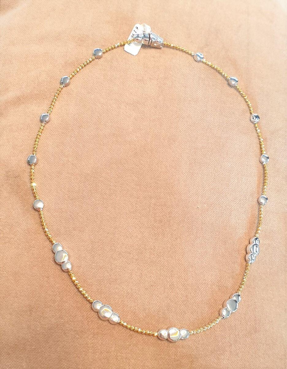 # Chaîne collier semi rigide en billes facettées or jaune et petits ronds or blanc 750/000