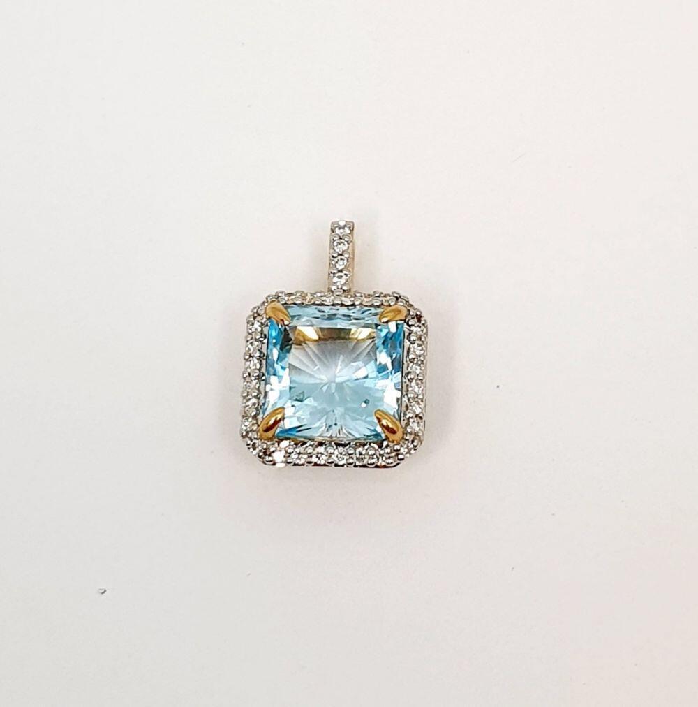 # Yellow gold pendant with 3.80ct topaz and surrounding 0.15ct natural diamonds
