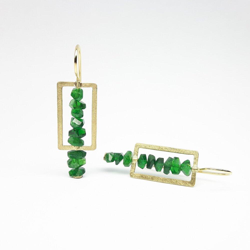 Earrings made from fine faceted tsavorite crystals and 18kt yellow gold. Unique piece.