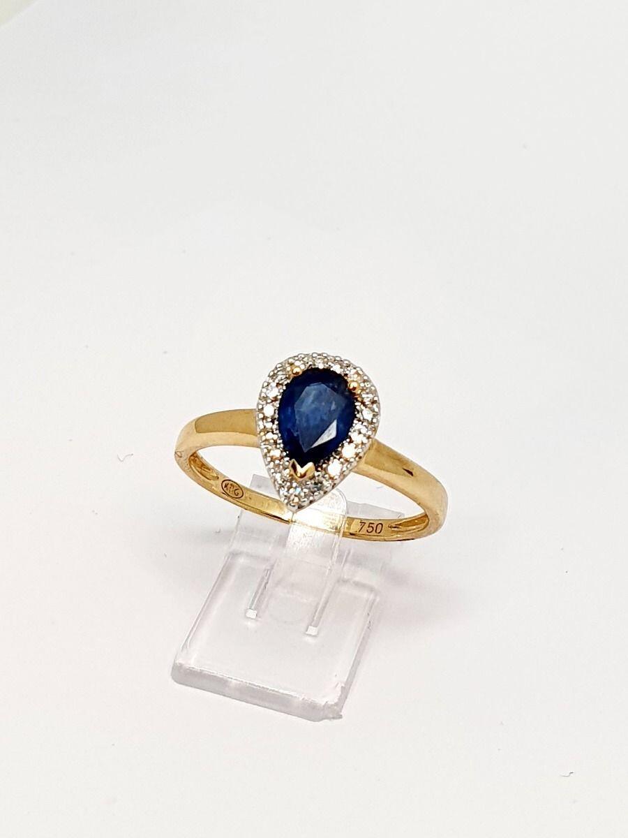 Yellow gold halo setting ring with 0.77ct pear-shaped sapphire and 0.10ct natural diamonds
