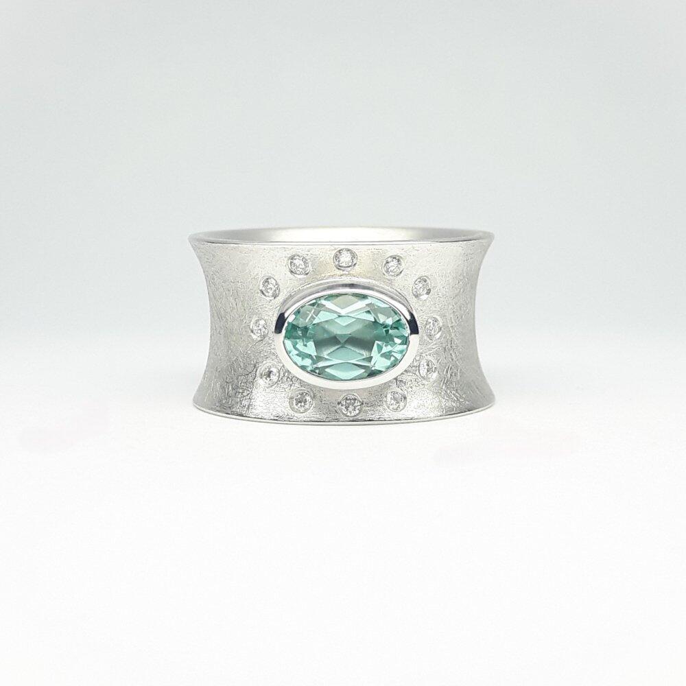 18k white gold ring featuring a mint-green tourmaline and diamonds. One of a kind.
