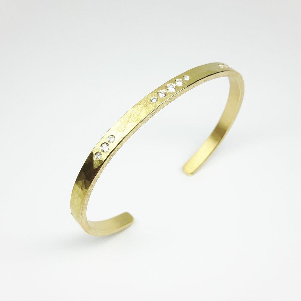 18kt yellow gold bangle hammered with 11 diamonds. Unique piece.