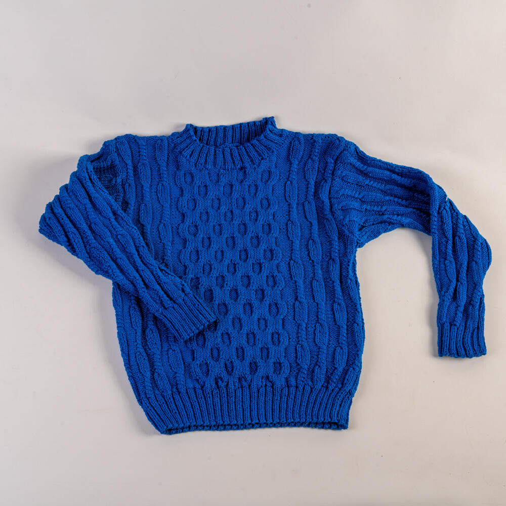 Children's sweater with knitted-in pattern and cables, hand-knitted