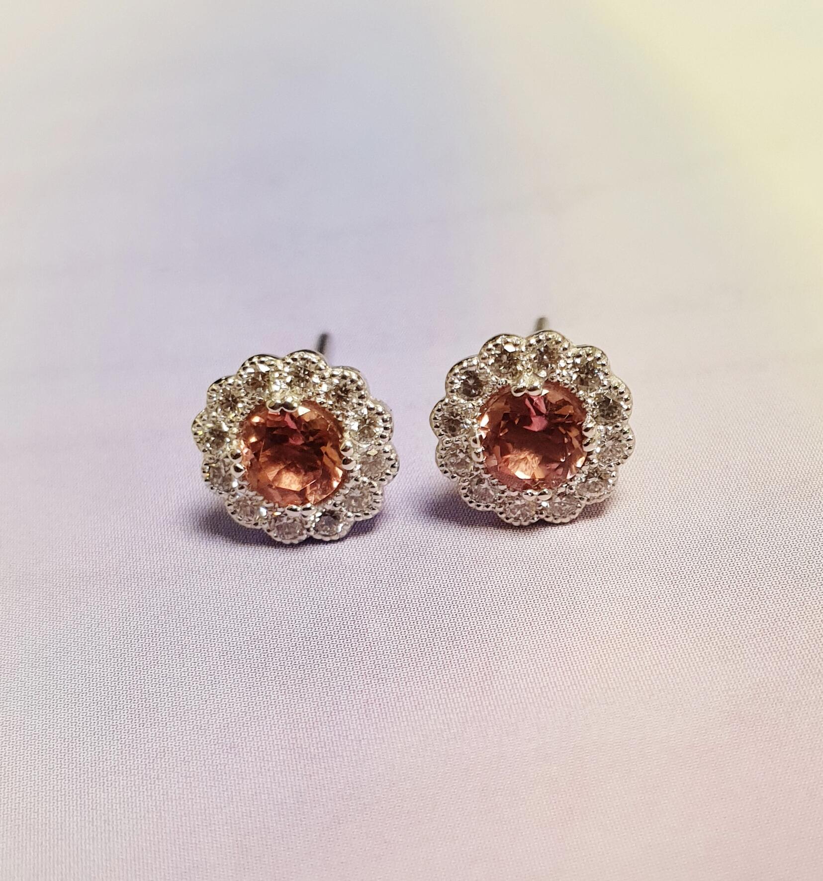 # White gold earrings with pink tourmaline and 0.24ct natural diamonds in a chased setting