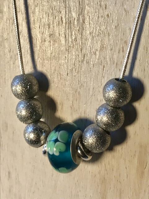 Silver necklace with green Murano bead