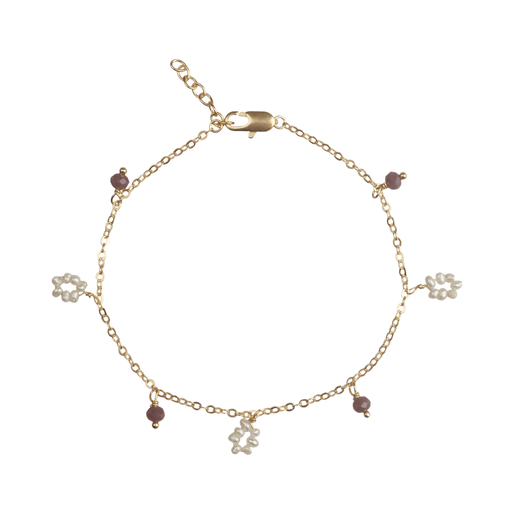 Light purple bracelet with flower-shaped freshwater pearls and small stones.