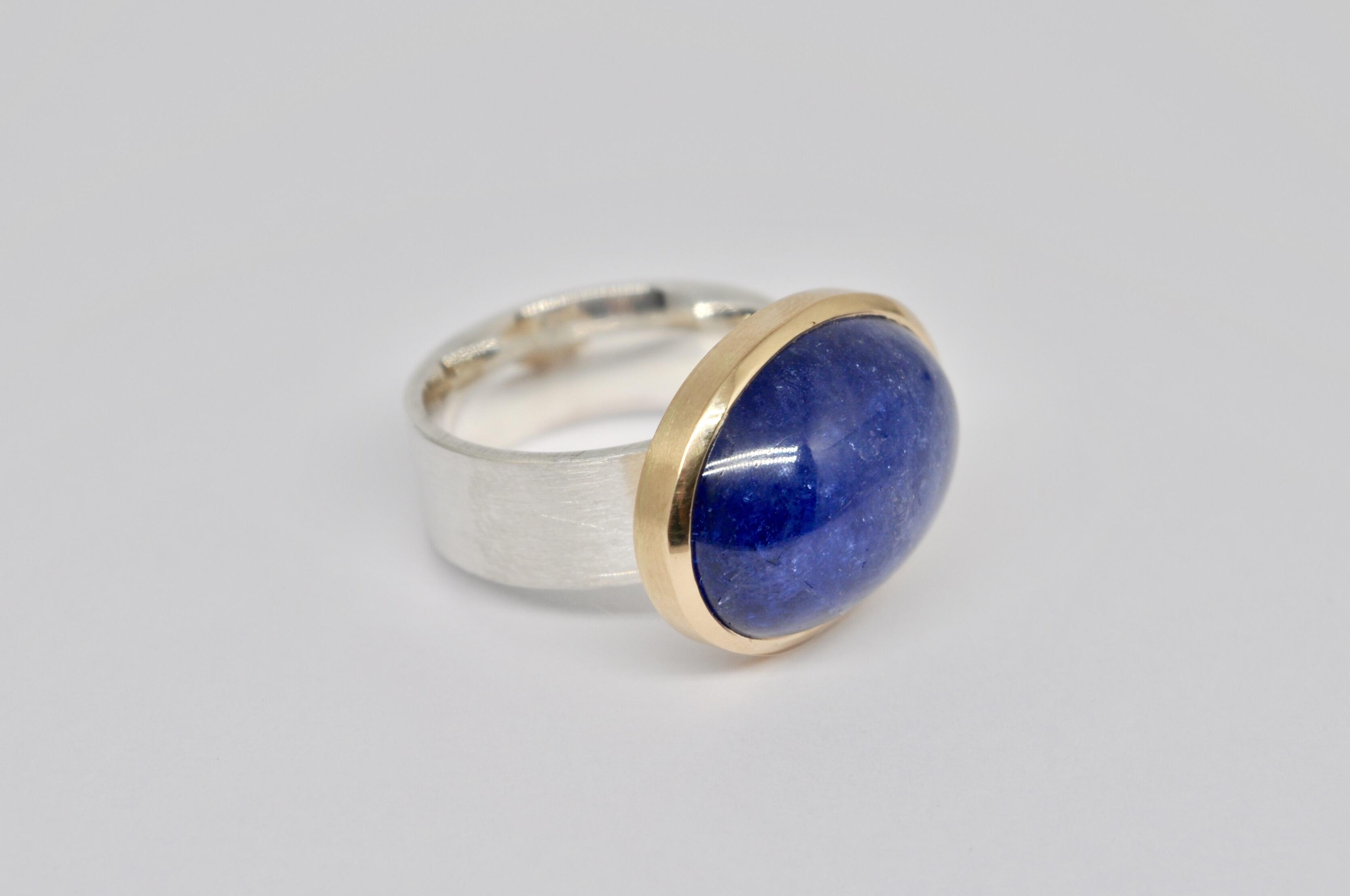 Silver and gold ring with a tanzanite stone