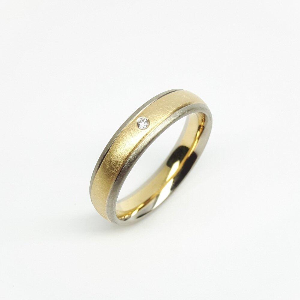 18k yellow and white gold ring with a diamond.