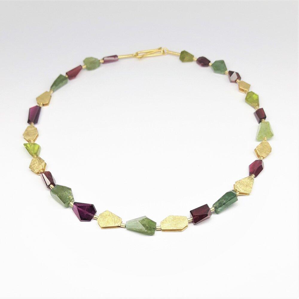 Gemstone necklace made of faceted garnet, tourmaline and 18kt yellow gold. Unique piece.