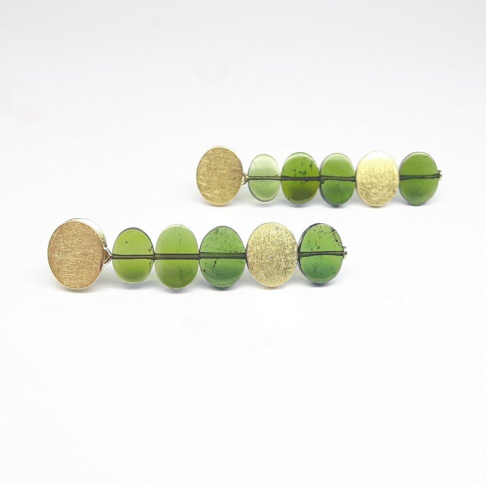 Earrings in 18kt yellow gold and green tourmalines.