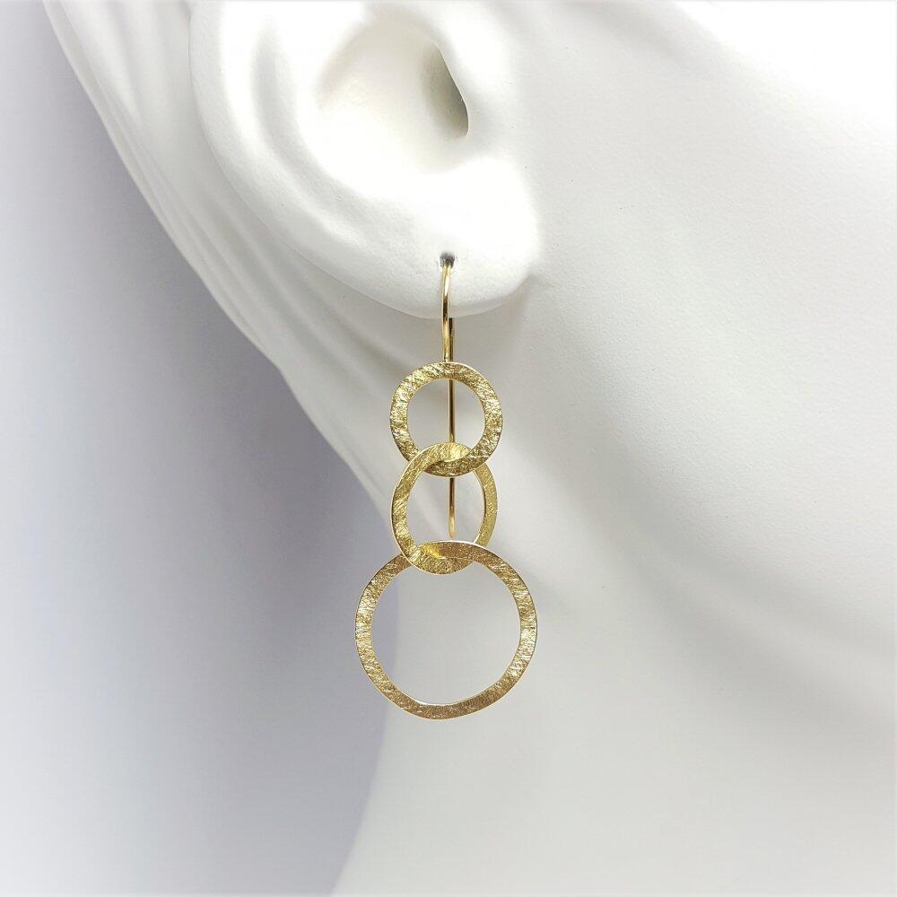 Boucle d'oreilles "dancing circles" en or jaune 18kt.