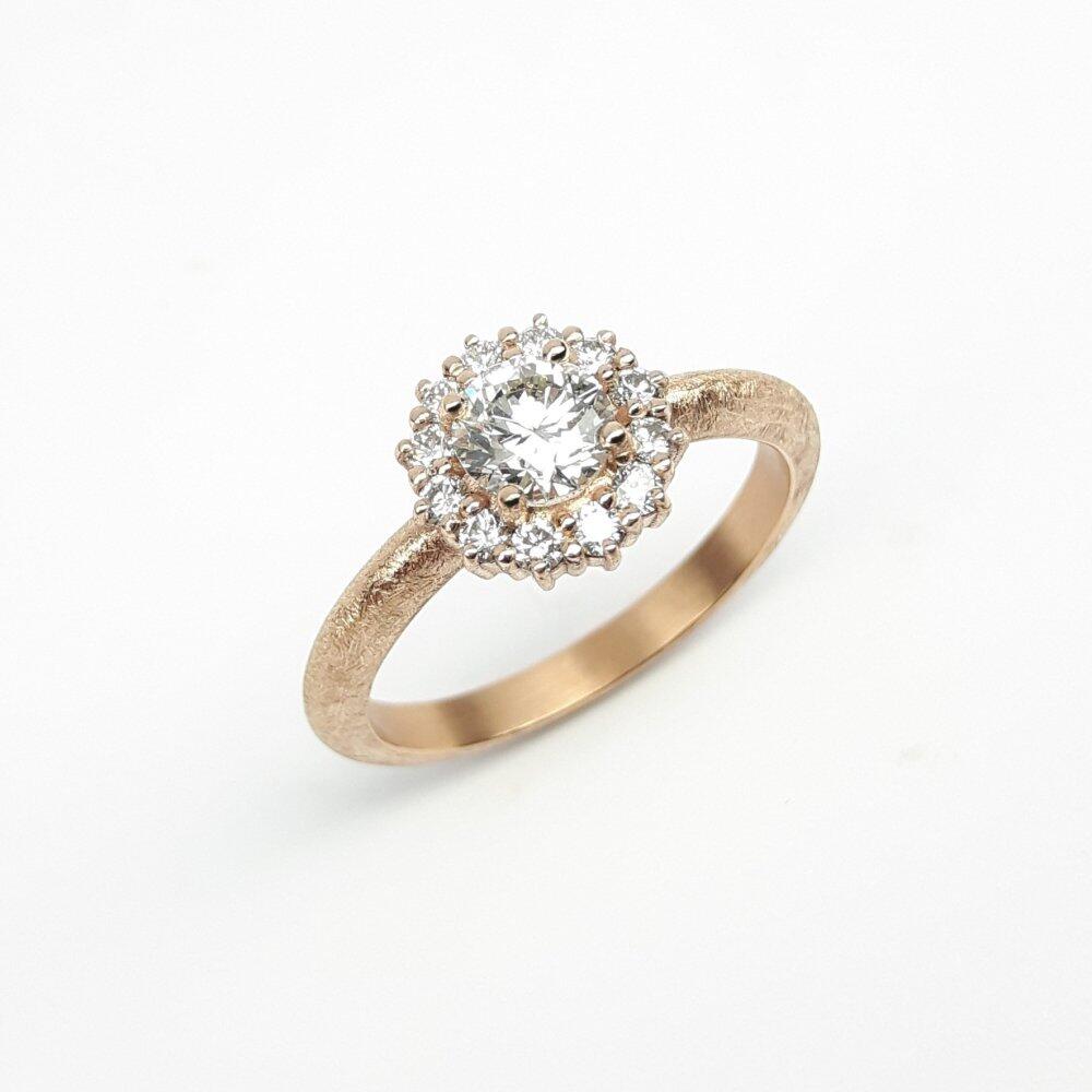 Ring in 18ct rose gold and 13 diamonds, total 0.76ct. Unique piece.