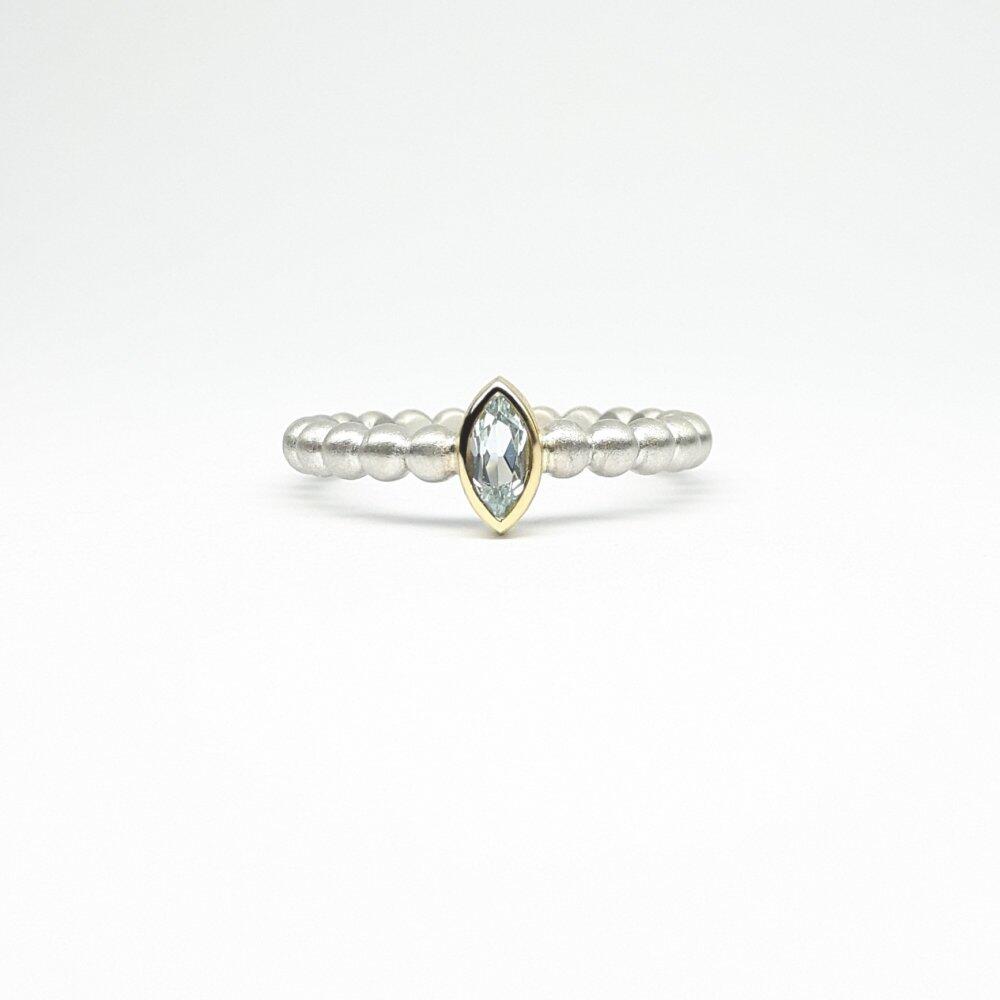 "round around", ball ring in 925 silver, 18kt yellow gold and aquamarine.