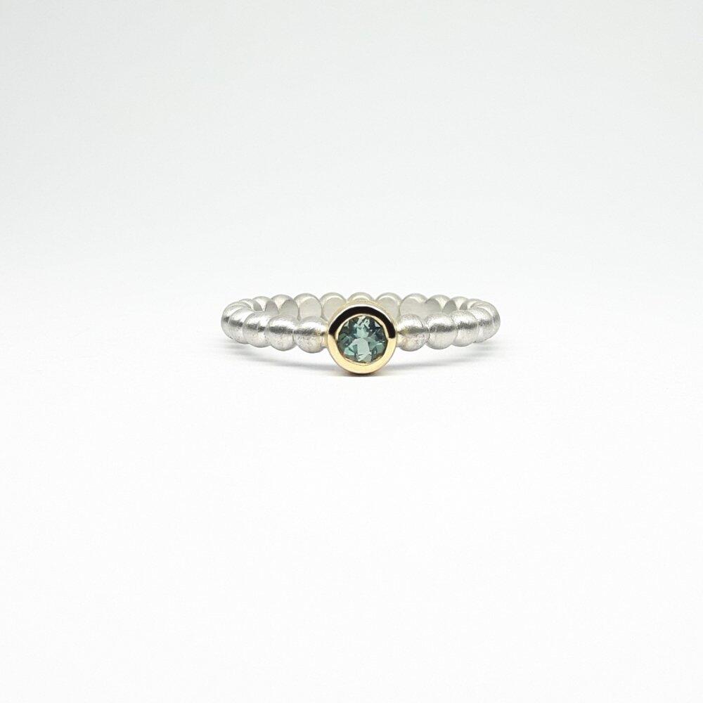 "round around", ball ring in 925 silver, 18kt yellow gold and blue-green tourmaline.