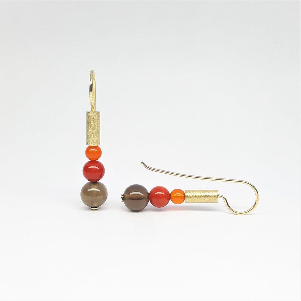 Earrings made of 18kt yellow gold, fire opal, coral and smoky quartz. Unique piece.