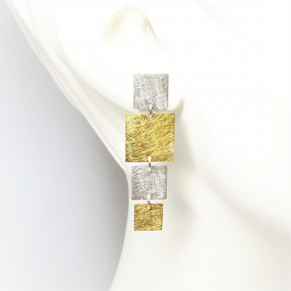 Boucles d'oreilles "dancing squares" en argent et or fin.