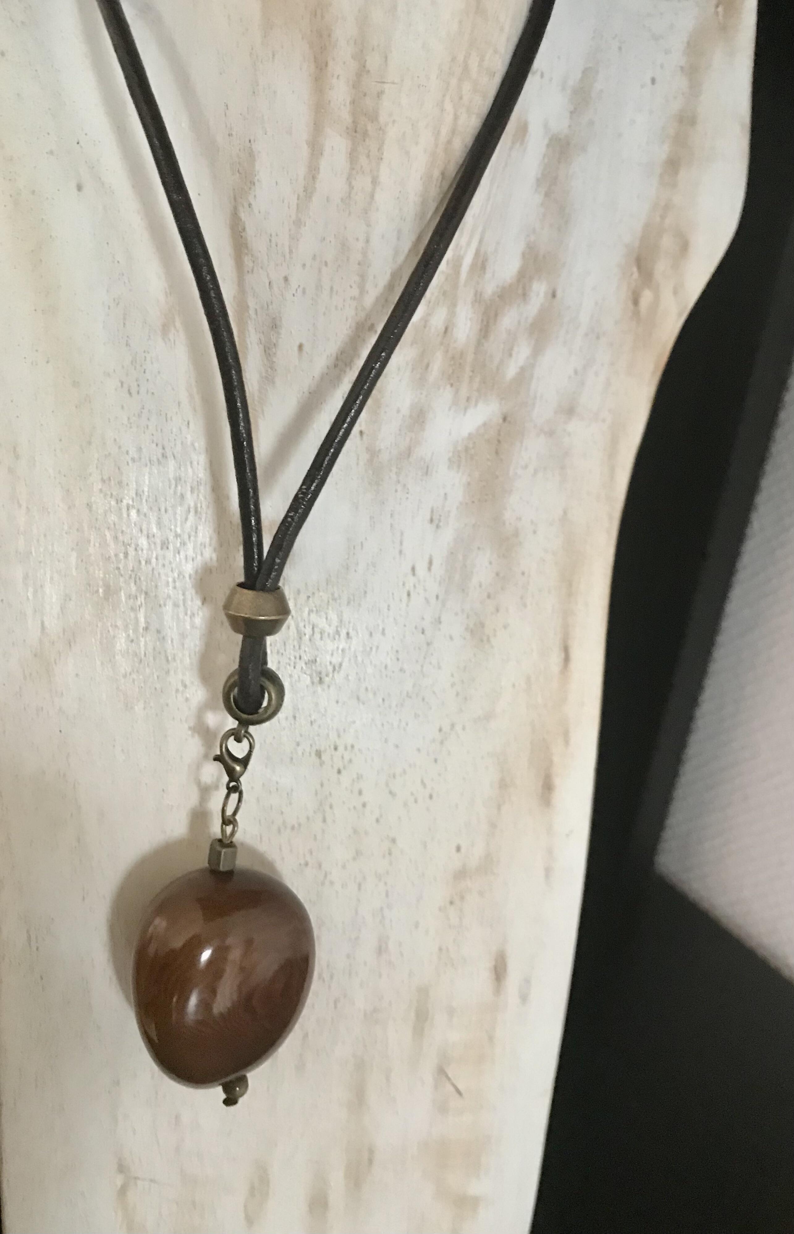 Brown leather necklace with Tagua nut pendant