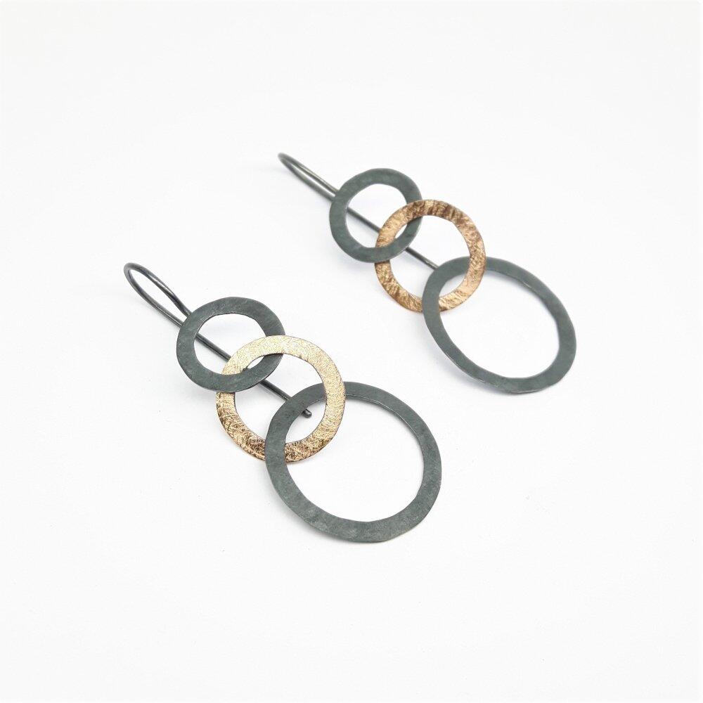 Stud earrings "dancing circles", 18kt rose gold and silver.