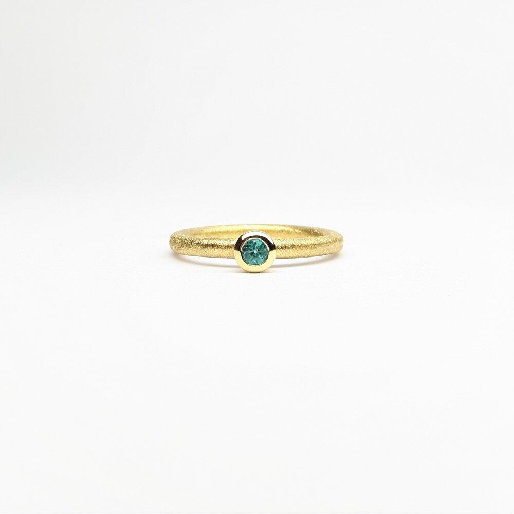 "combiring mini", 18kt yellow gold and tourmaline Paraiba Ø3mm.