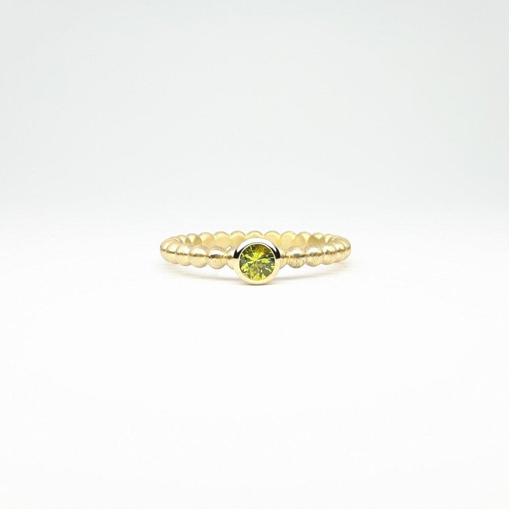 "round around", ball ring in 18kt yellow gold and sapphire Ø3.9mm.