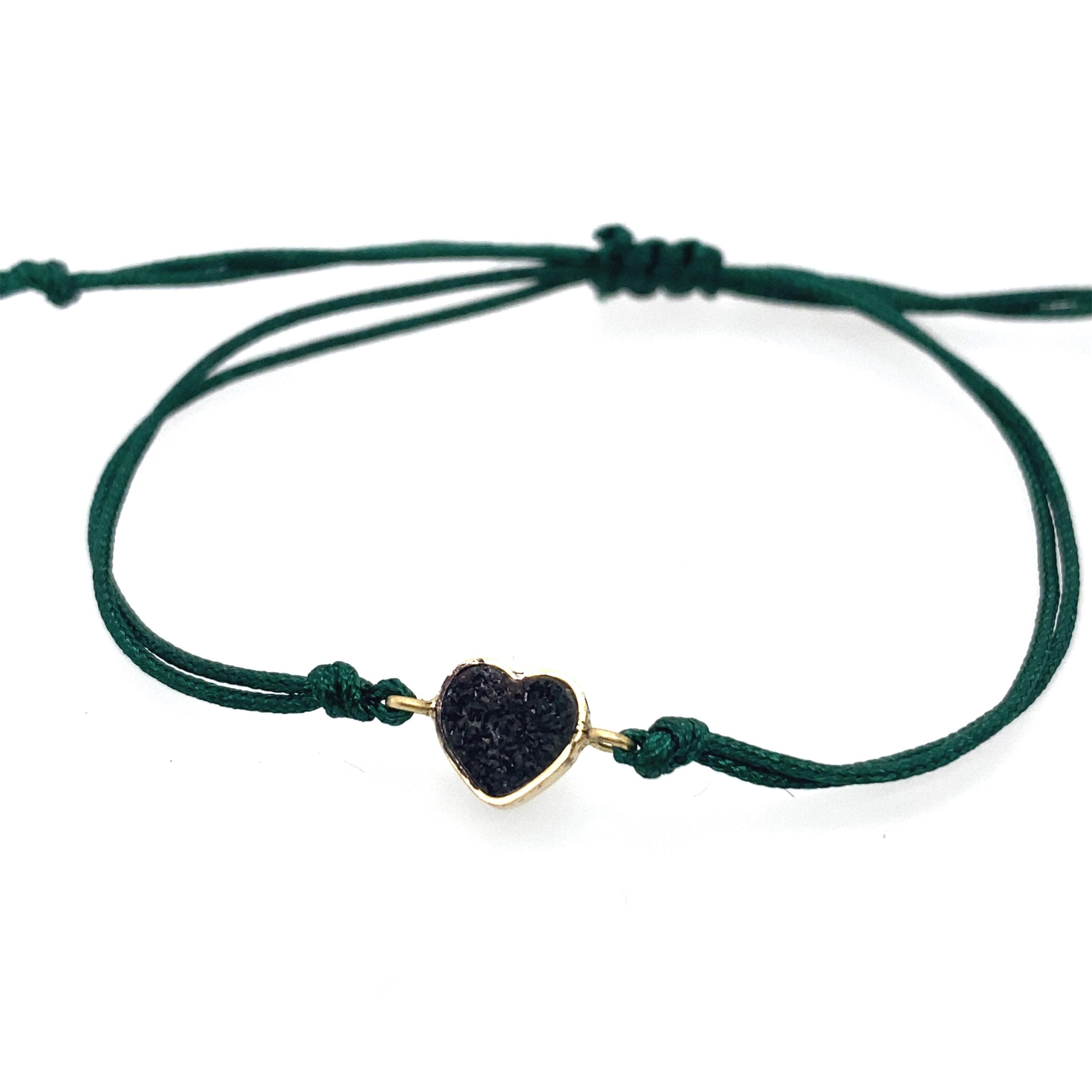 Bracelet with 18 ct 750/- yellow gold element and onyx heart/Nancy Fis Jewellery