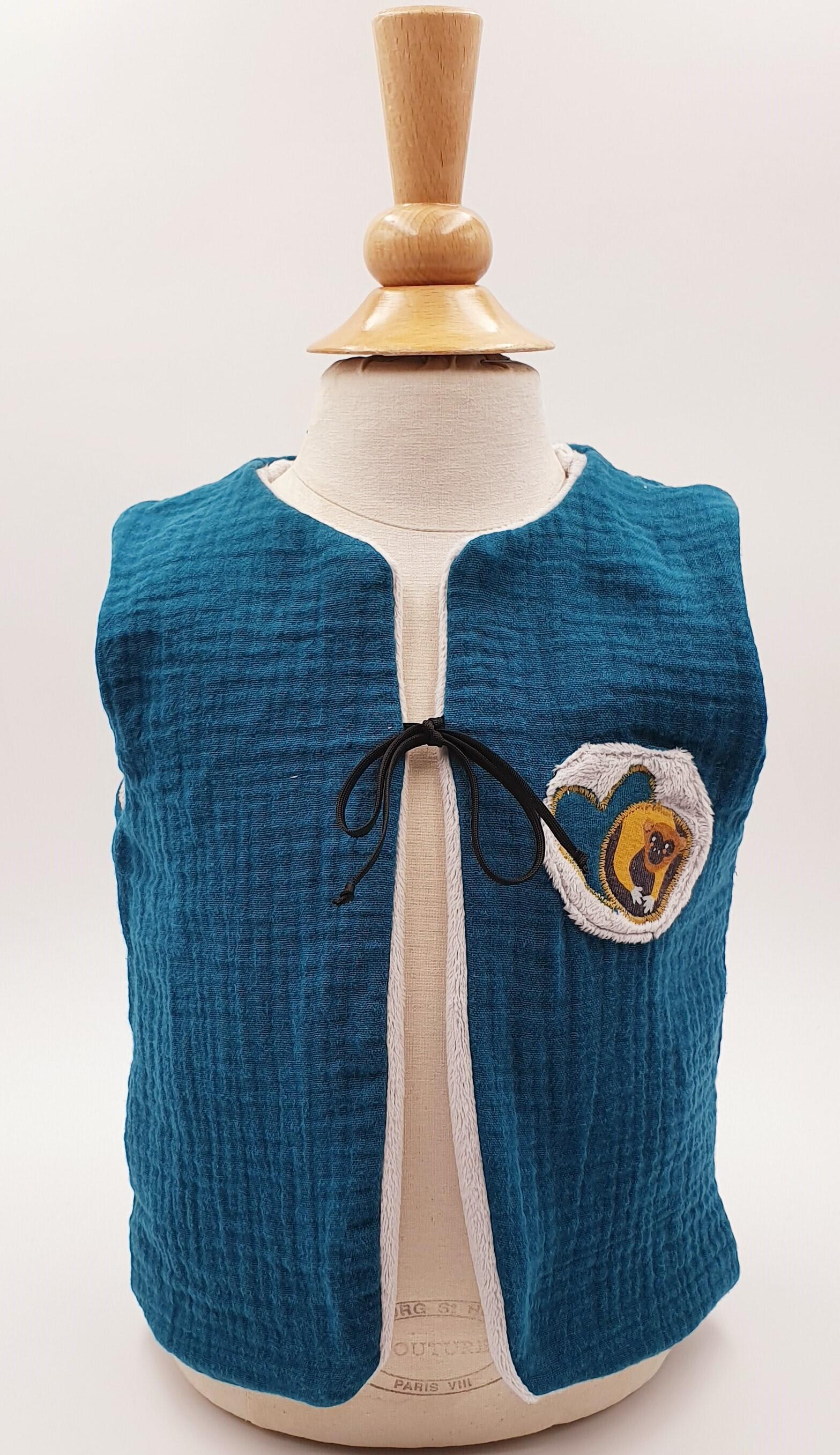 Peacock blue" reversible vest