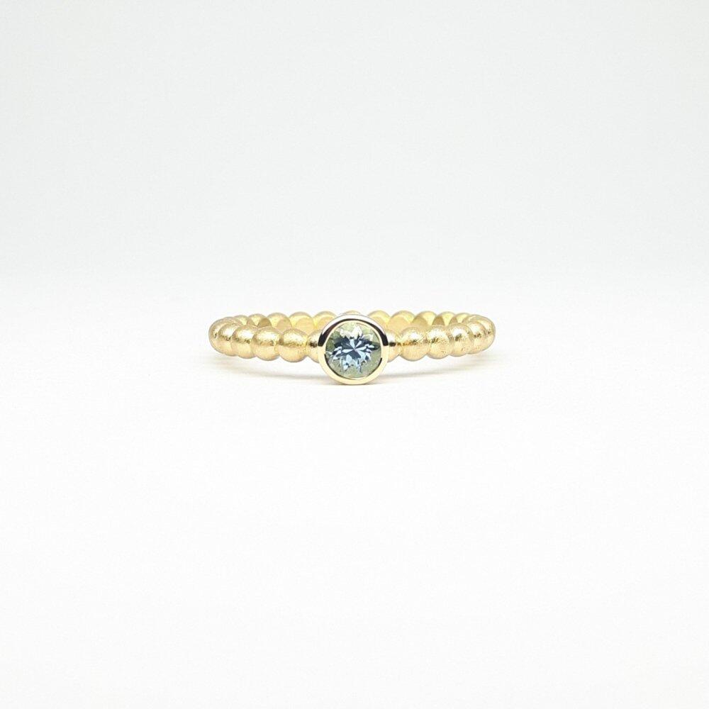 "round around", ball ring in 18kt yellow gold and aquamarine Ø4mm.