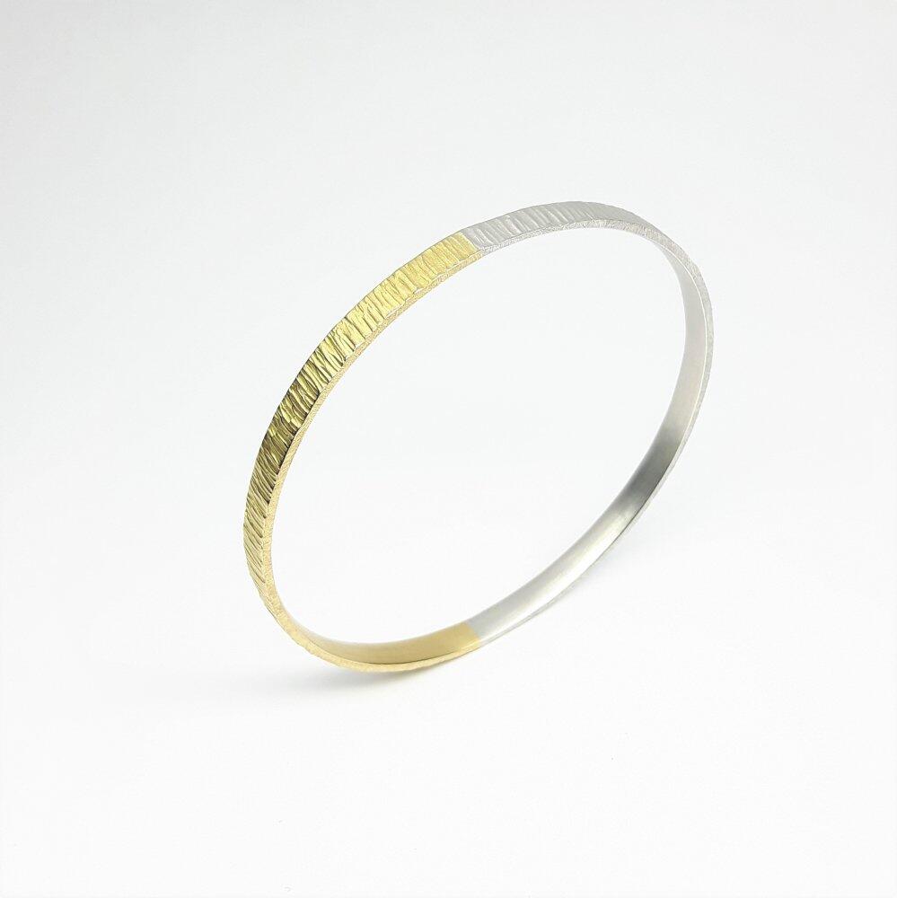 "all-round", bracelet en or jaune 18kt et argent 925/-.