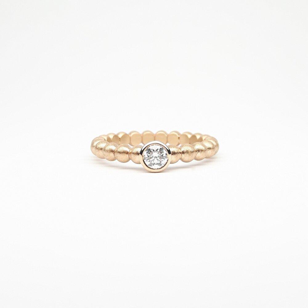 "round around", ball ring made of 18kt rose gold and 0.20ct diamond.