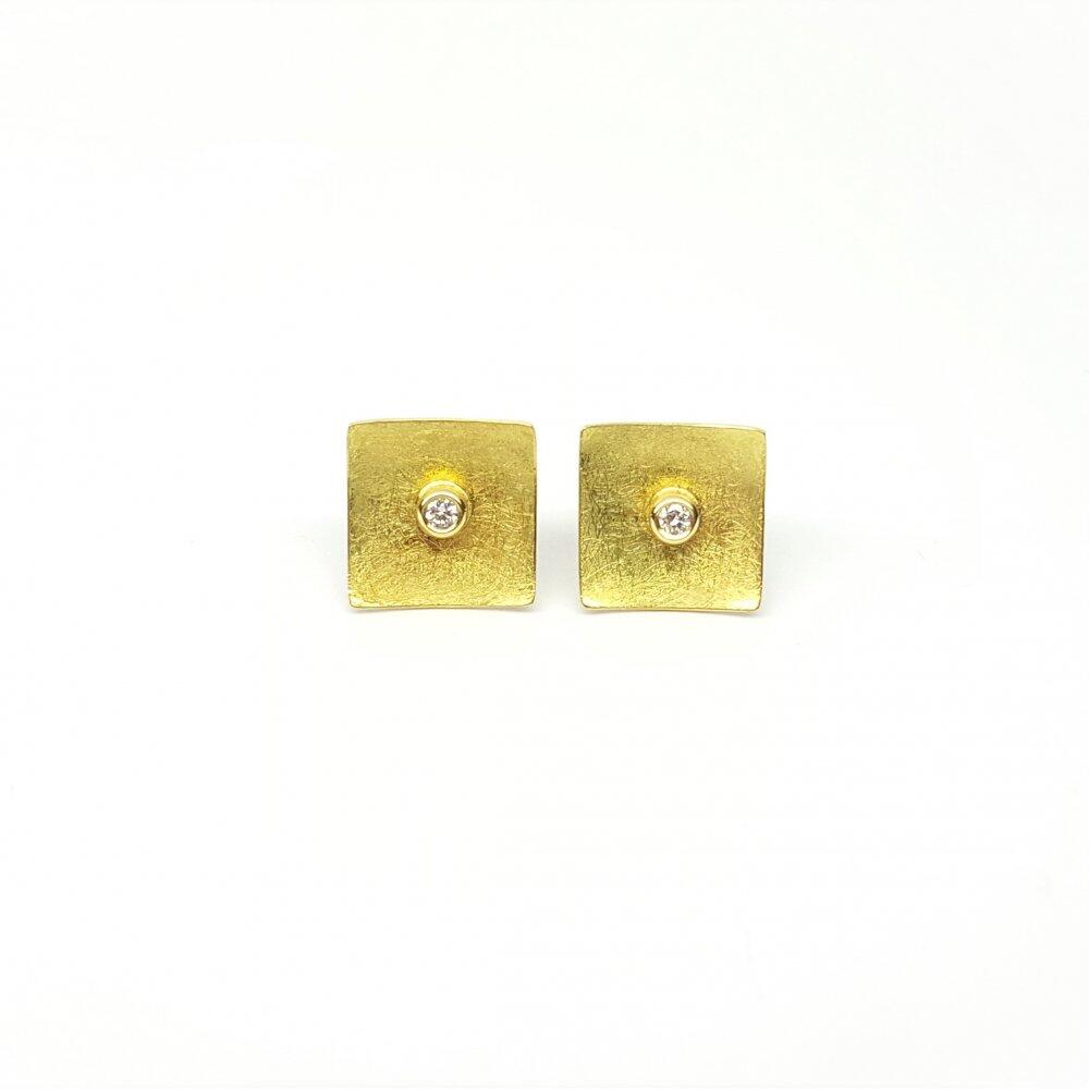 18k yellow gold and diamond stud earrings.