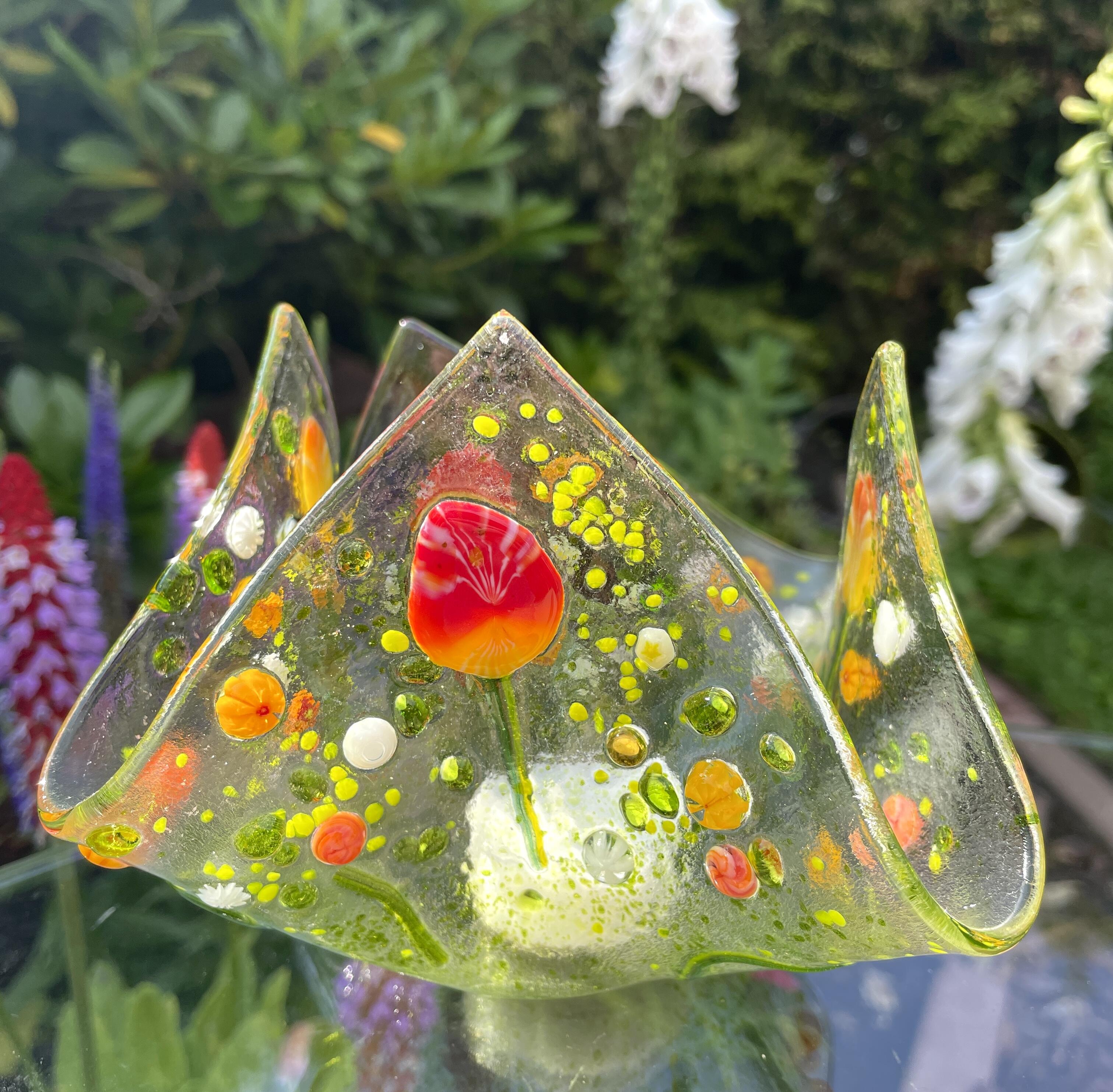 Teelicht aus transparentem Glas mit Blumen Millefiori, rot/orange, Einzelstueck
