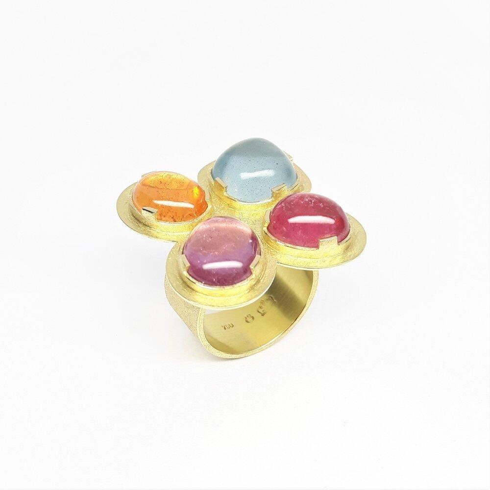 "rolling stones", ring in 18kt yellow gold, tourmaline, aquamarine and mandarin garnet. Unique piece.