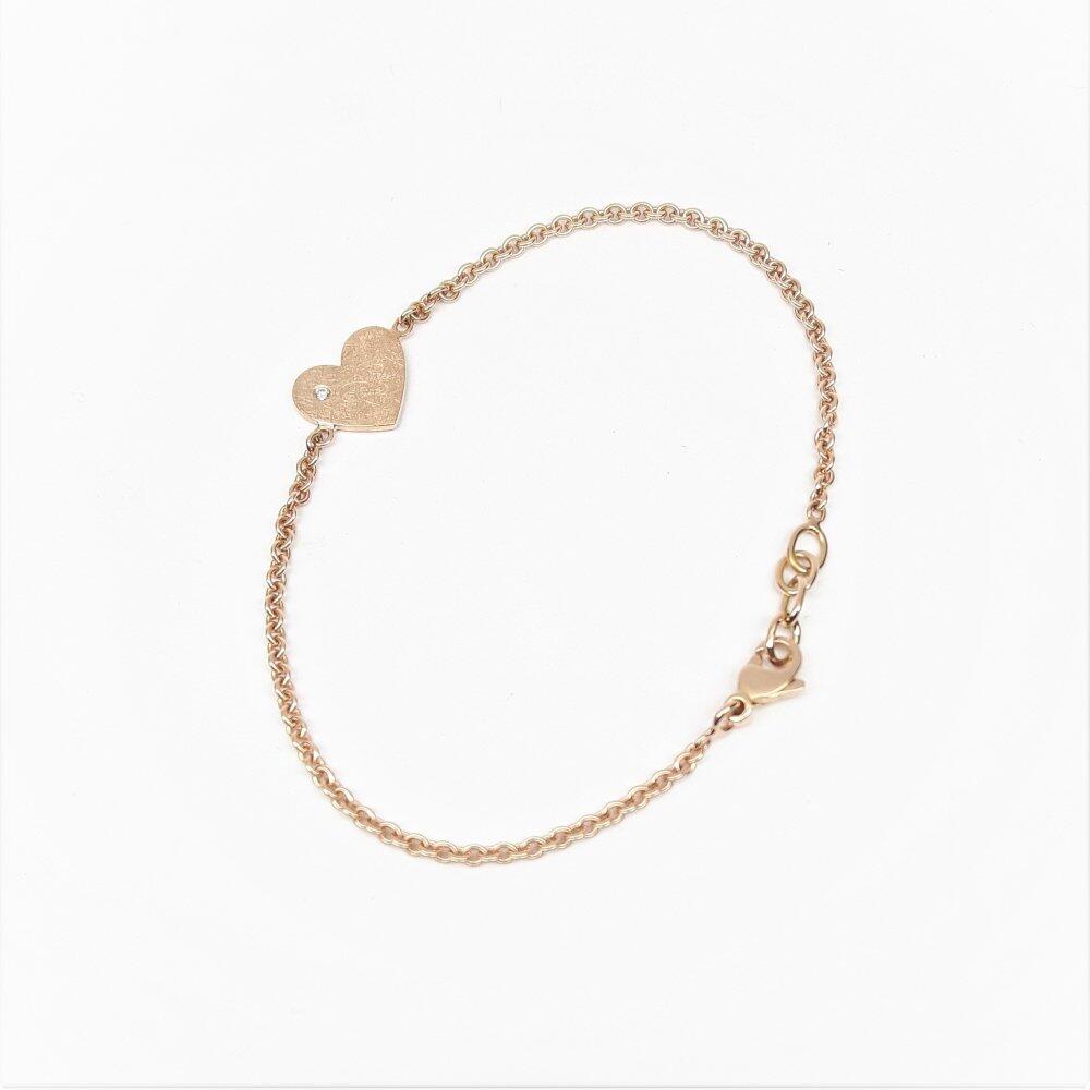 "glittering heart", Herz-Armband aus 18kt Rotgold und Diamant.