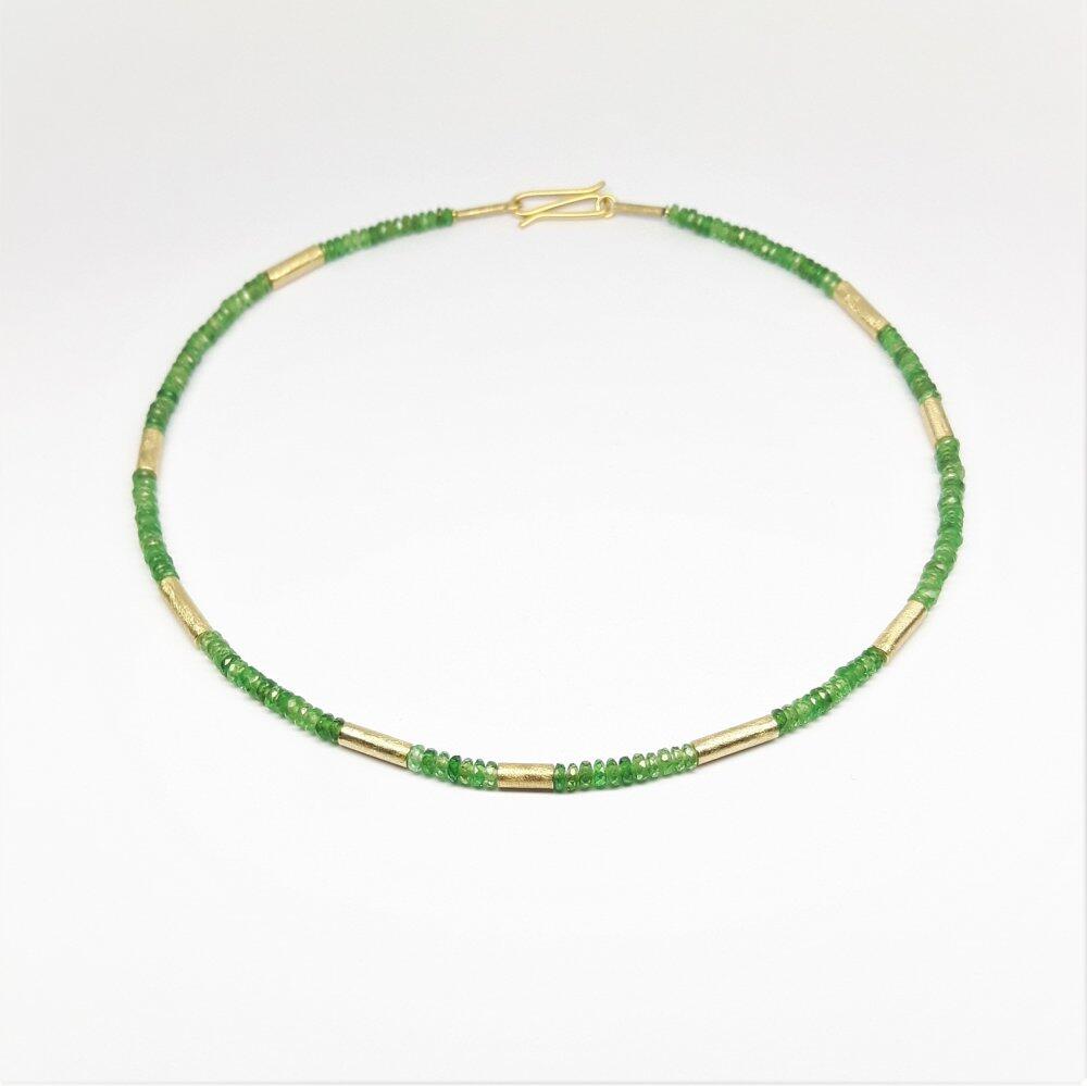 Gemstone necklace made from fine faceted tsavorite rondelles. Unique piece.