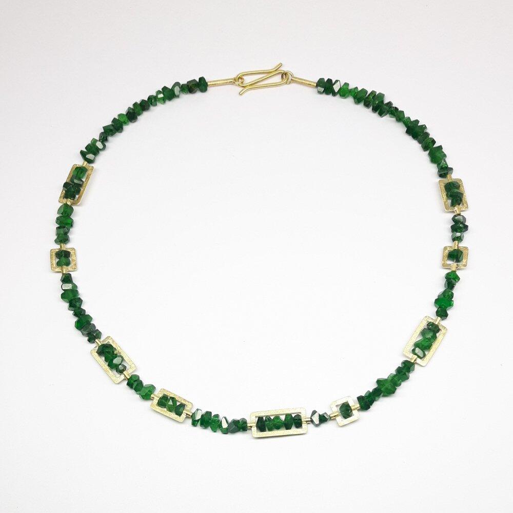 Gemstone necklace made from fine faceted tsavorite crystals and 18kt yellow gold. Unique piece.