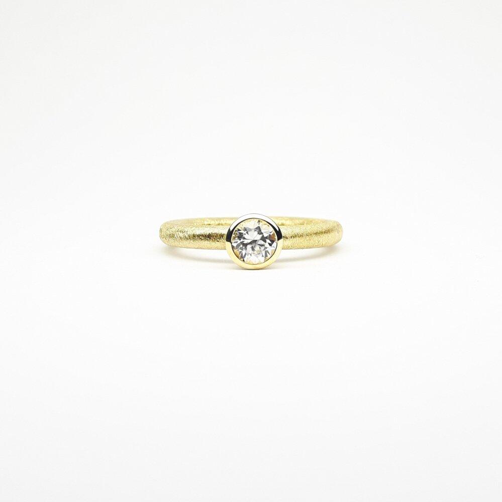 "combiring small", 18kt yellow gold and natural zircon Ø5mm.