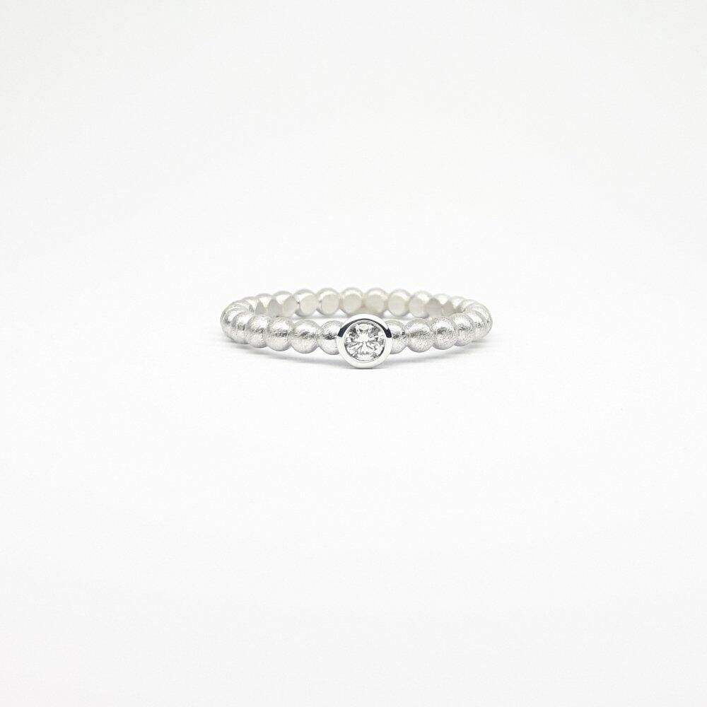 "round around", ball ring in 18kt white gold and 0.09ct diamond.