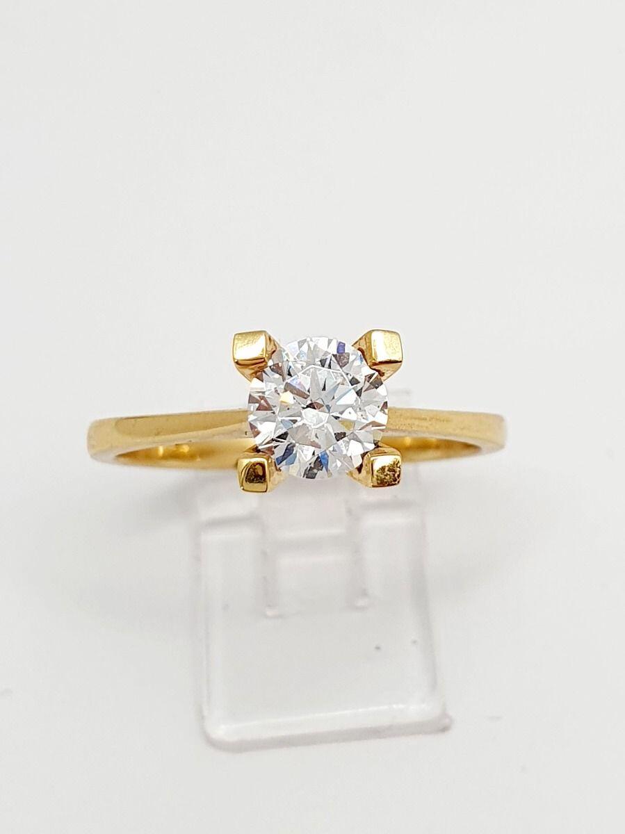 # Yellow gold solitaire ring with zircon