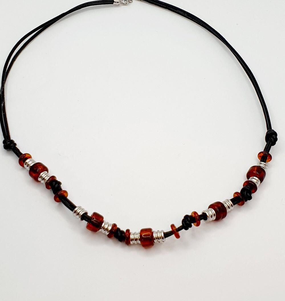 # Black leather necklace with amber and silver parts