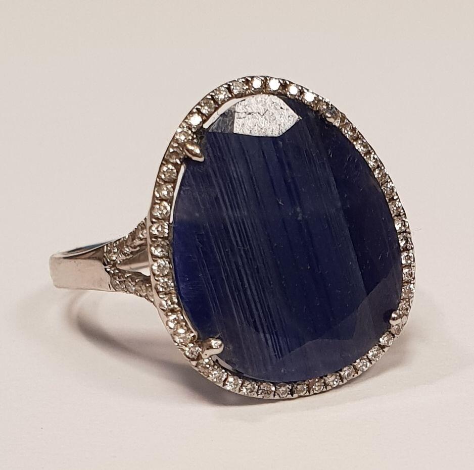 # White gold ring with 0.270ct diamond and a flat rough sapphire