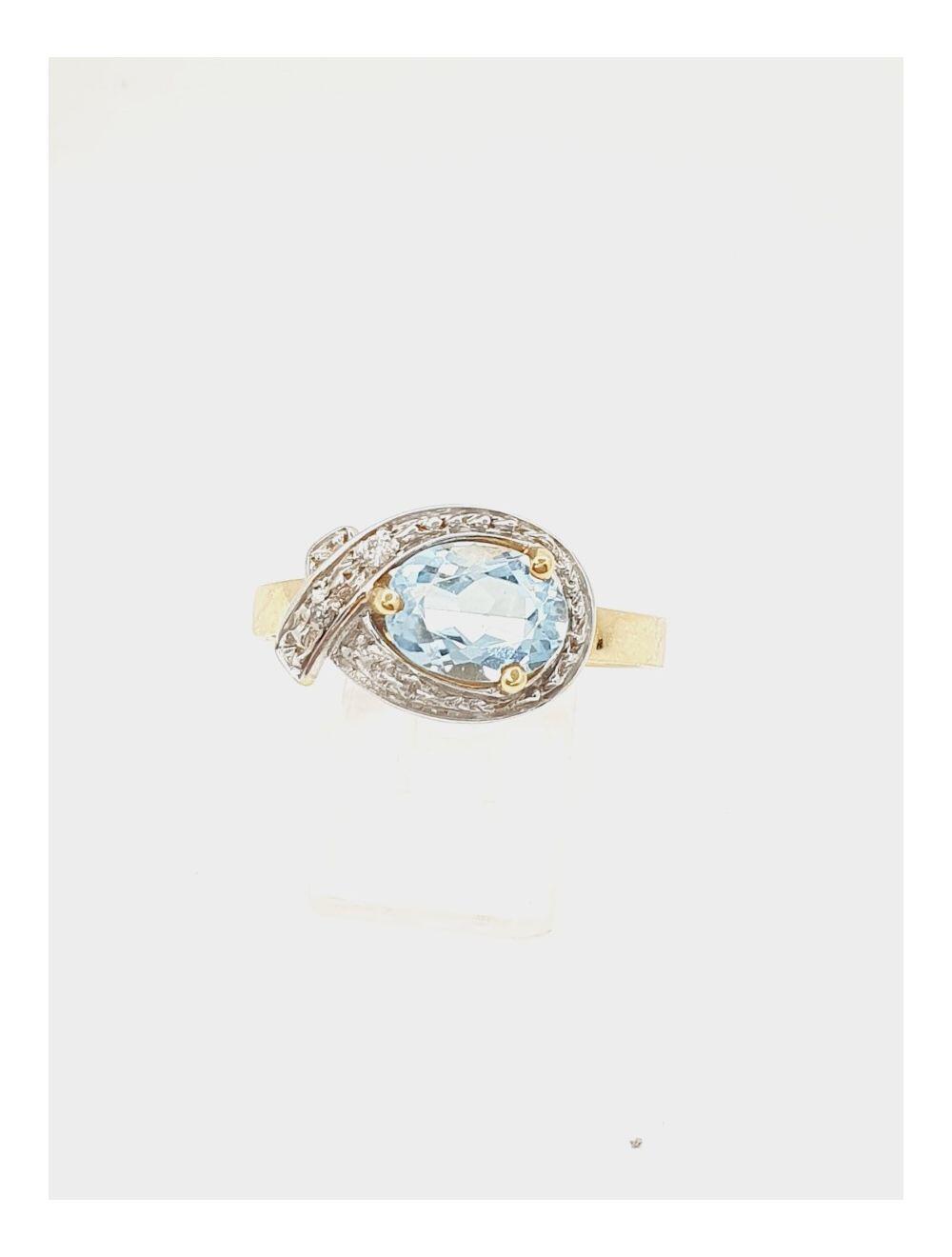 # Yellow and white gold ring with blue topaz and 0.02ct natural diamonds