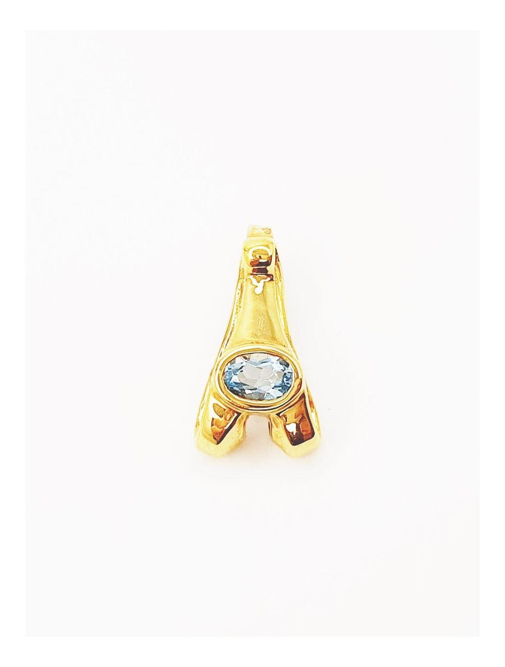 # Yellow gold pendant with blue topaz