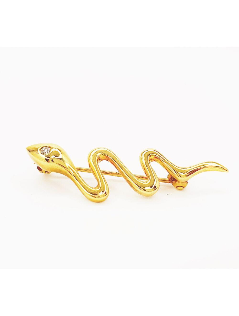 # Yellow gold snake brooch with 0.03ct natural diamond